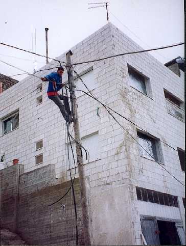 The electric lines had to be made safe. Notice the plastic sheeting already replacing the windows.