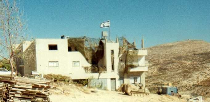 Typical occupied house being used as a barracks, this house was on the outskirts of Old Askar and has been covered with camouflage netting by the IDF.