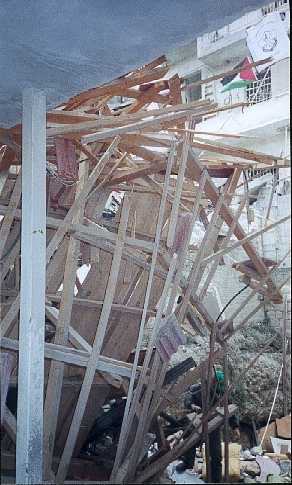 The roof that you can see in the earlier pictures is now just this pile of splintered timbers.