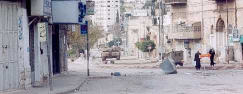 Tanks and jeeps caused destruction and disruption over a wide area of Nablus while people tried to get on with their lives.