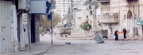 Tanks and jeeps caused destruction and disruption over a wide area of Nablus while people tried to get on with their lives.